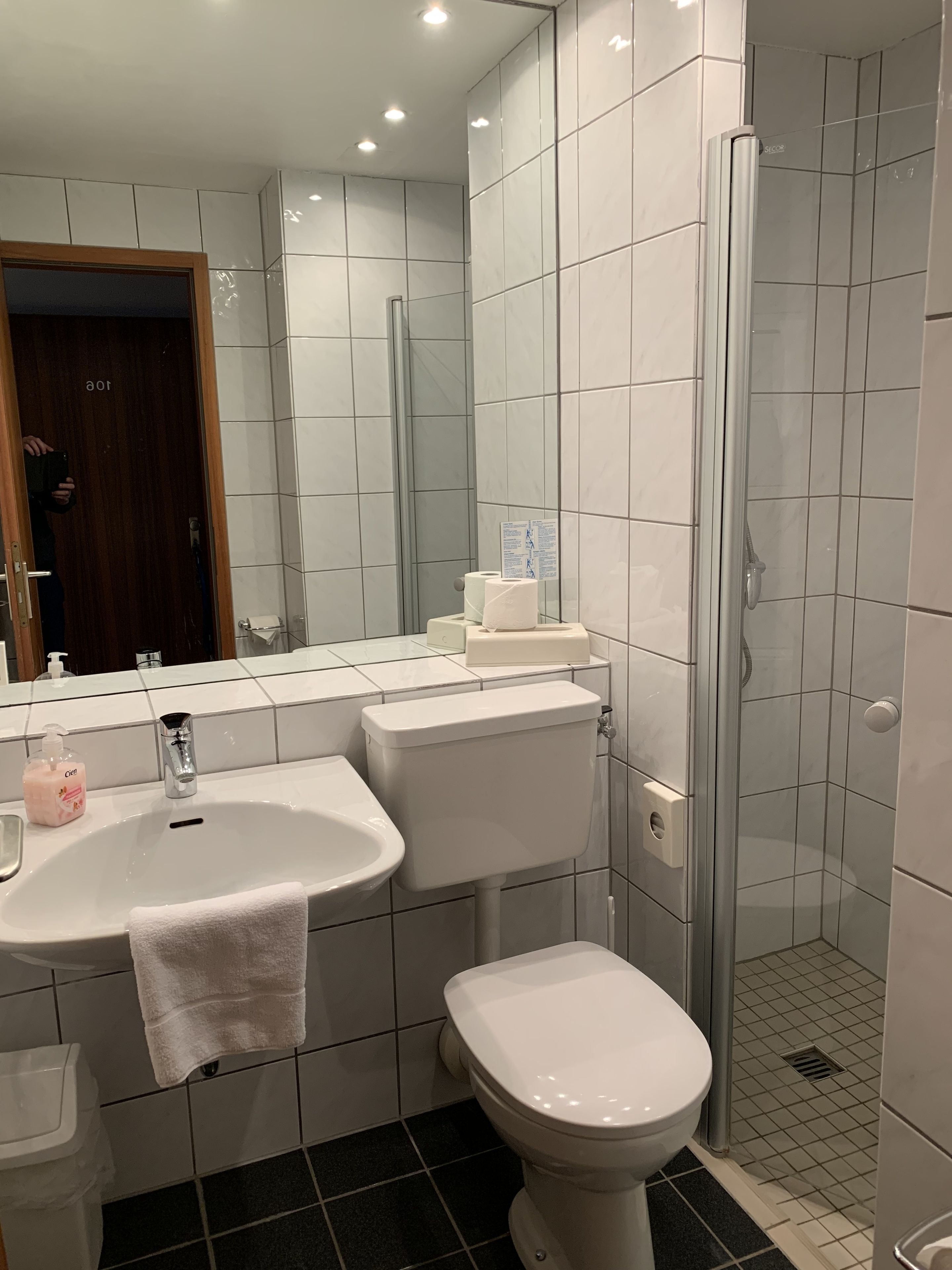 Shower, rainfall showerhead, hair dryer, towels