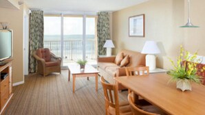 Suite, 2 habitaciones, cocina | Área de sala de estar | Televisión de pantalla plana 