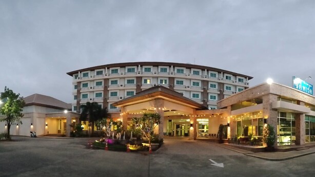 A multi-story hotel with a curved facade, a well-lit entrance, and a visible signboard. - City Park Hotel (Nakhon Ratchasima)
