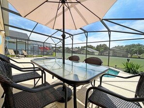 Outdoor dining - Beautifully updated three bedroom, two bath pool home with spa and games room! (Davenport)