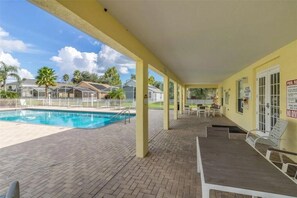 A heated pool, sun loungers