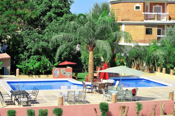 Outdoor pool, pool umbrellas, pool loungers