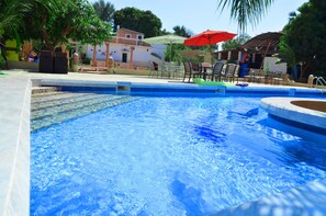 Outdoor pool, pool umbrellas, pool loungers