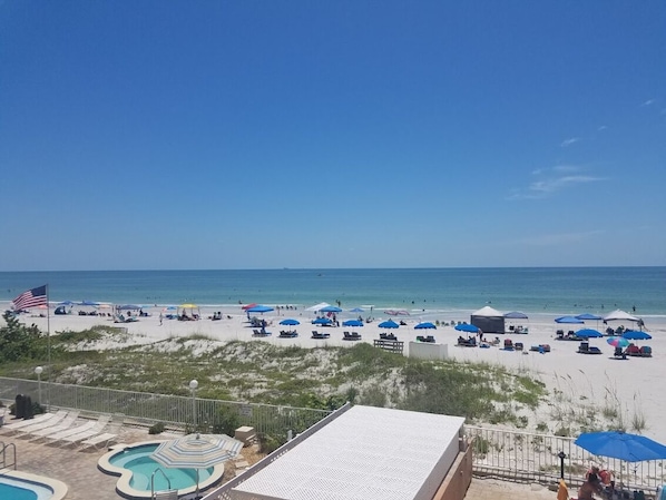 On the beach, sun loungers, beach towels