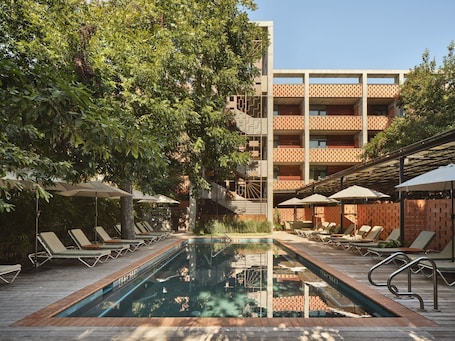 Outdoor pool, open 8:00 AM to 10:00 PM, pool umbrellas, pool loungers