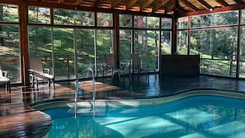 Indoor pool, open 9:00 AM to 9:00 PM, pool umbrellas