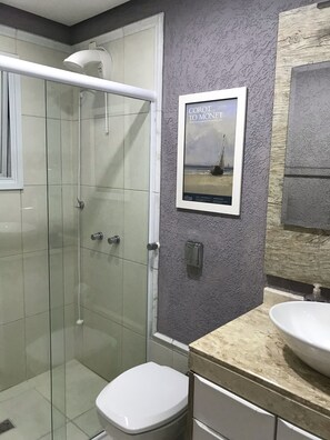 Shower, hair dryer, towels, toilet paper