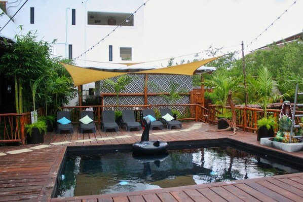 Outdoor pool, open 9:00 AM to 9:00 PM, pool umbrellas, sun loungers