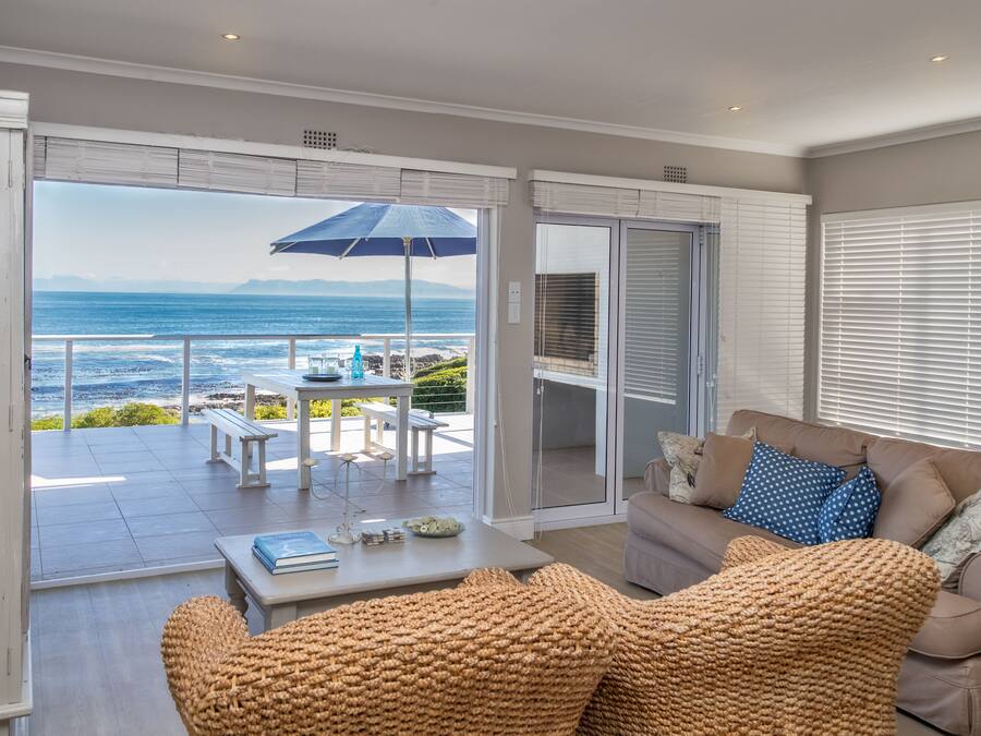 Superior House, 4 Bedrooms, Sea View, Oceanfront | Living area | 50-inch flat-screen TV with satellite channels, TV, fireplace