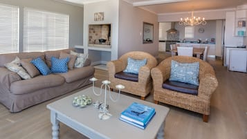 Superior House, 4 Bedrooms, Sea View, Oceanfront | Living area | 50-inch flat-screen TV with satellite channels, TV, fireplace