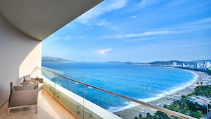 A balcony with a view of the ocean and a beach. - Sky Beach D20 Nha Trang Hotel (Nha Trang)