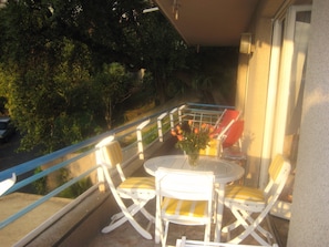 Terrace with three French doors leading to the outside area