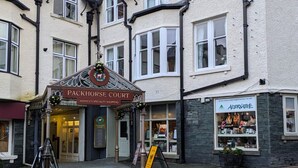 A building with a Packhorse Court sign, a Packhorse Court sign, and a sign for Alternative Lifestyle.