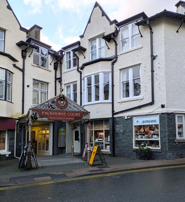 A building with a Packhorse Court sign, a Packhorse Court sign, and a sign for Alternative Lifestyle.