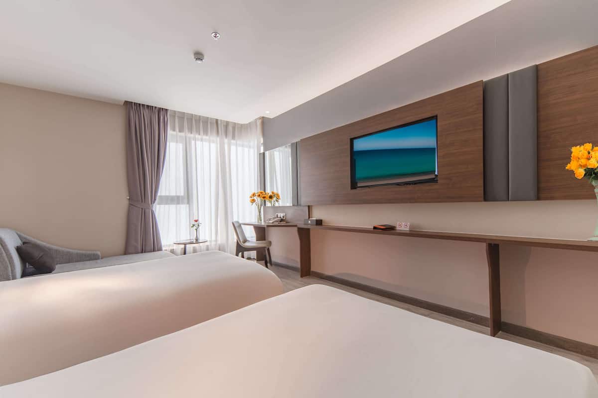 Camera Deluxe, 2 letti singoli, vista mare parziale | 17 camere, biancheria da letto di alta qualità, minibar