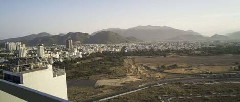 A cityscape with a view of mountains in the background.
