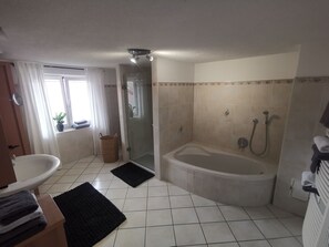 Combined shower/tub, hair dryer, towels, toilet paper