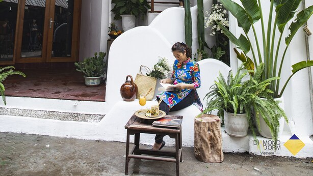 A boutique hotel entrance with a sign reading "Diamond Room Vietnam," a staircase leading to the entrance, and various potted plants around the area. - Diamond Dorm Vietnam - Hostel (Hanoi)