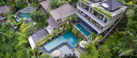 Indoor pool, outdoor pool, pool umbrellas, sun loungers