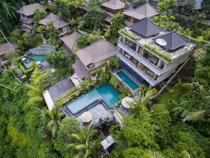 Indoor pool, outdoor pool, pool umbrellas, pool loungers