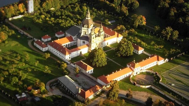 An aerial view of a large, historic building complex with multiple wings and a central tower. - Hotel Monte Pacis (Kaunas)