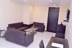 Luxury Suite | Living room | 40-inch LED TV with cable channels, TV - Siddhi Hotel & Resort (Rajula)