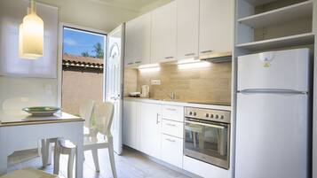 Apartment, 2 Bedrooms (Ground Floor) | Private kitchen | Fridge, electric kettle, cookware/dishes/utensils