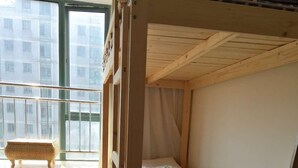 A bunk bed room with a window and a small bench. - Pinkhostelling laternational (Shanghai)