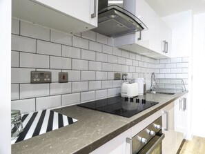 Business Apartment, 1 Bedroom, Non Smoking | Private kitchen | Full-size fridge, microwave, oven, stovetop