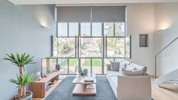 Premium Loft, 1 Queen Bed, Pool Access, Pool View | Living room | Flat-screen TV