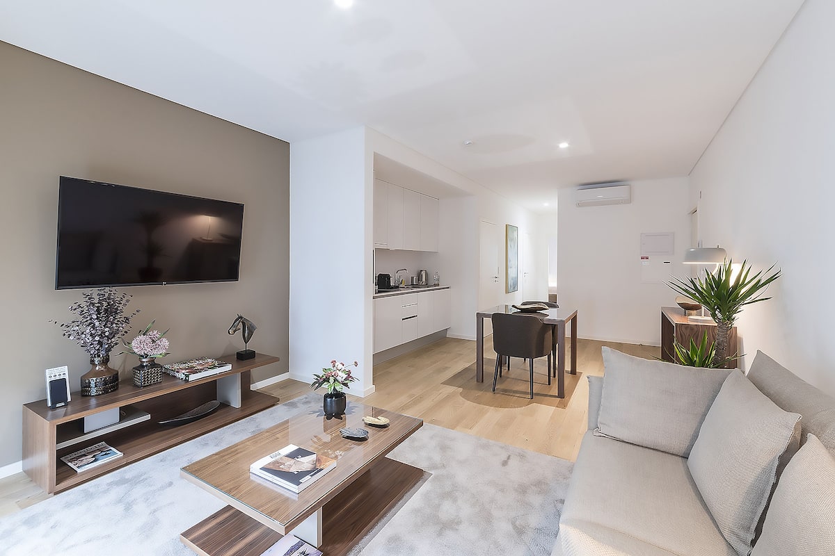 Premium Apartment, 1 Queen Bed, Pool Access, Pool View | Living area | Flat-screen TV