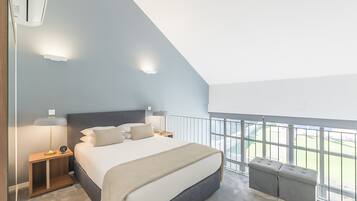 Premium Loft, 1 Queen Bed, Pool Access, Pool View | In-room safe, individually decorated, blackout drapes, soundproofing