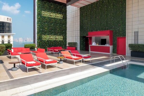 Outdoor pool, pool umbrellas, pool loungers