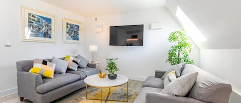 Two Bedroom Sleep 3 Apartment | Living area | Flat-screen TV