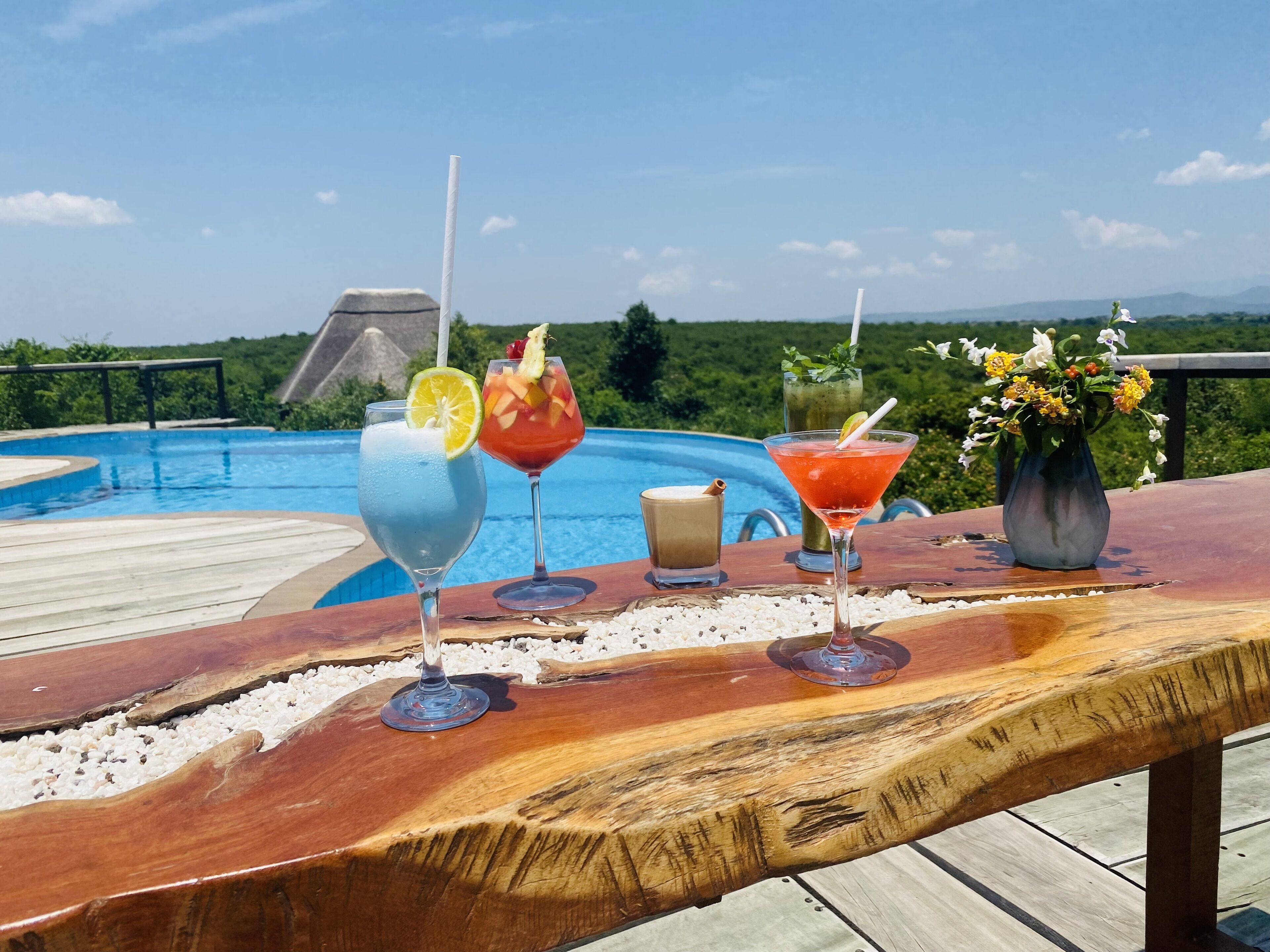 Outdoor pool, open 11:00 AM to 5:30 PM, pool umbrellas