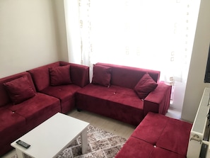Departamento, 1 habitación | Área de sala de estar | Televisión de pantalla plana 