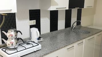 Apartment, 1 Bedroom | Private kitchen | Fridge, stovetop, electric kettle, cookware/dishes/utensils