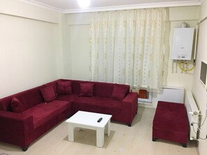 Departamento, 1 habitación | Área de sala de estar | Televisión de pantalla plana