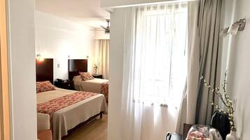 Executive Triple Room, City View | Premium bedding, down comforters, pillowtop beds, minibar