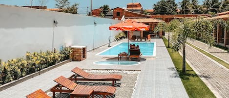 Indoor pool, pool umbrellas, pool loungers
