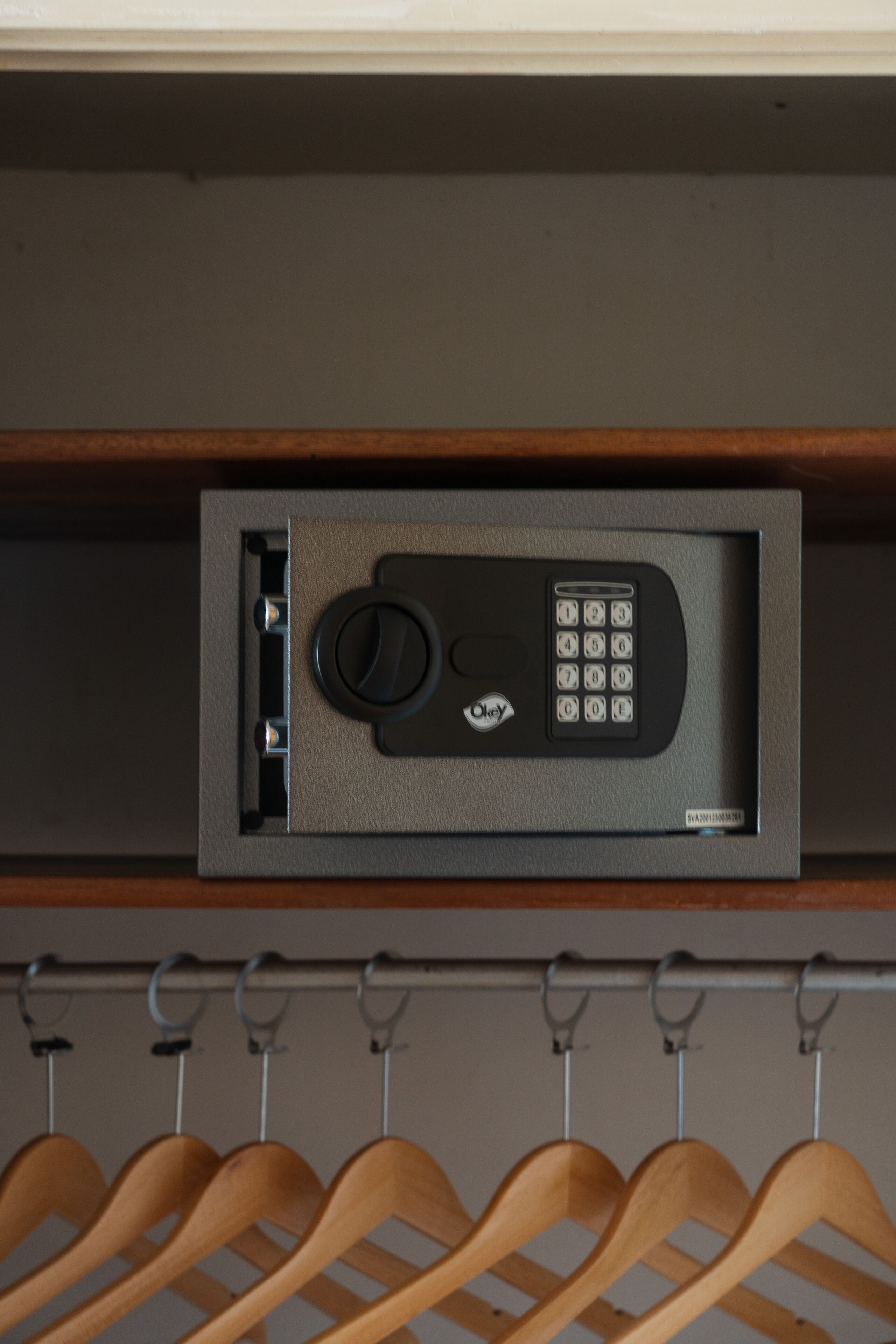 A security keypad and a wooden hanger rack.