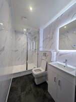 Shower, free toiletries, hair dryer, bathrobes
