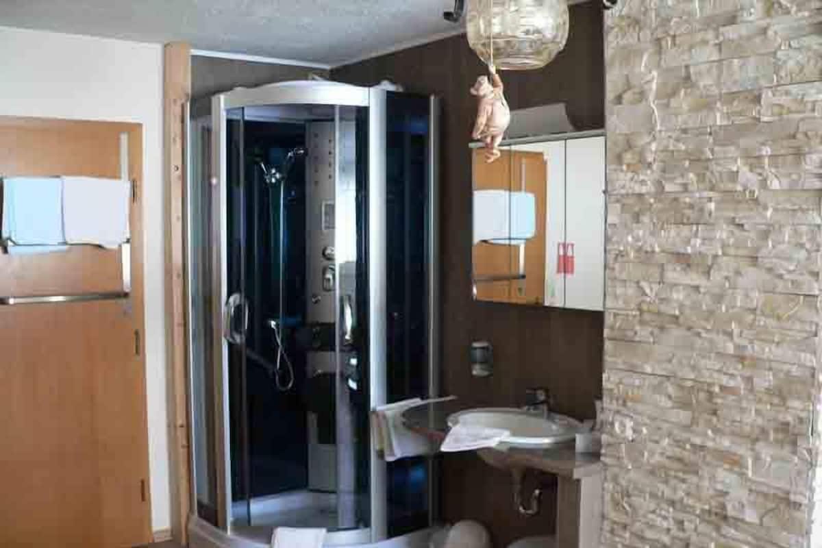 Shower, free toiletries, hair dryer, slippers