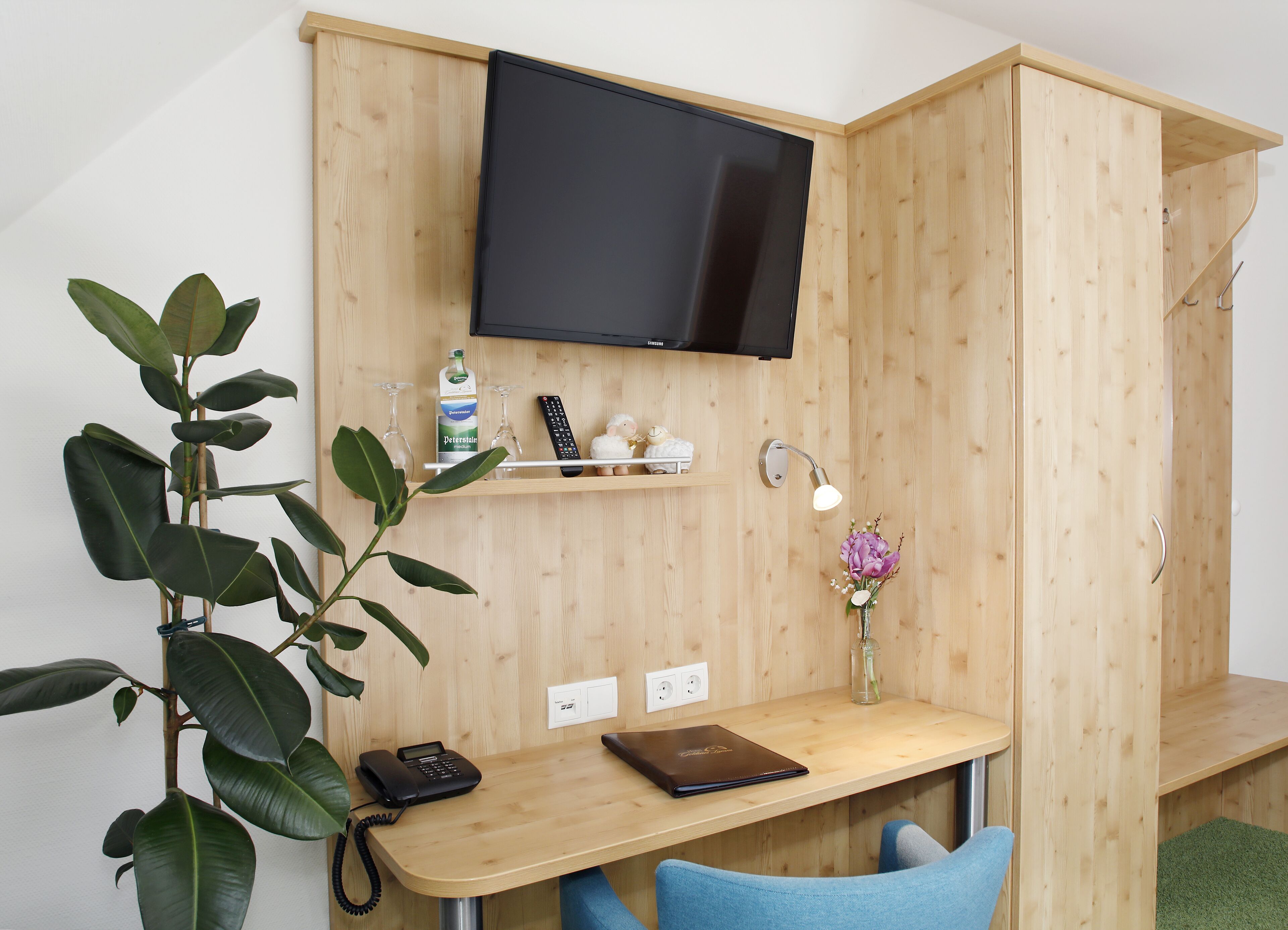 family quadruple room | living area | flat-screen tv