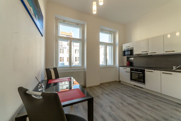 Apartment 3 | Private kitchen | Fridge, microwave, oven, cookware/dishes/utensils - Apartmany LETNA u SPARTY (Prague)