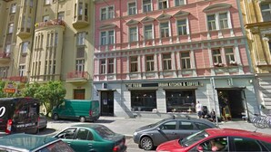 A multi-story building with a ground-floor Urban Kitchen & Coffee shop.