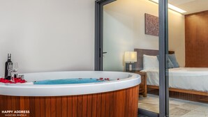 A modern bathroom with a freestanding bathtub, a wooden vanity, and a glass shower enclosure. - Trendy 1BR Apartment in Cruz con Mar brand new building by Happy Address (Playa del Carmen)