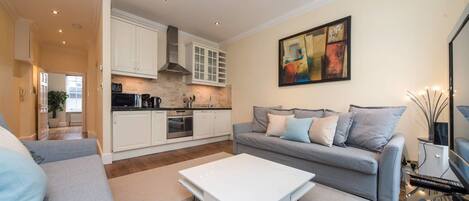 Apartment, 1 Bedroom | Living room | Flat-screen TV