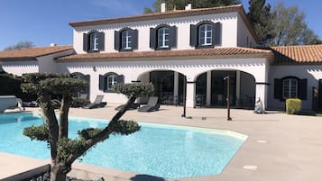 Seasonal outdoor pool, open 10:00 AM to 7:30 PM, pool umbrellas