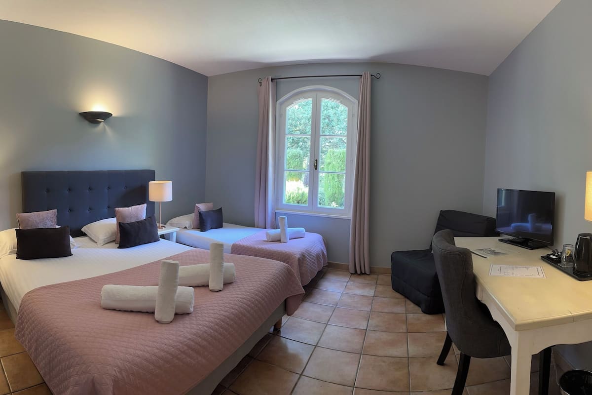 superior triple room, ensuite, garden view | 1 bedroom, in-room safe, individually decorated, individually furnished